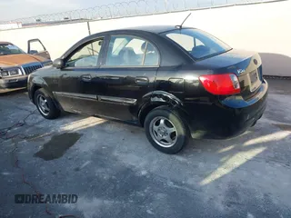 2010 Kia Rio LX with VIN KNADH4A33A6668719, listed as a IAAI auction lot 41777544 with 124,400 mi miles. Bid and sale history available at carsss.com. Image 3.