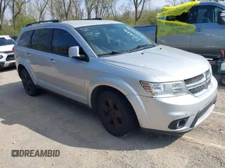 2012 Dodge Journey SXT z VIN 3C4PDDBG0CT205989, wystawiony jako IAAI lot #42024605 z przebiegiem 189 017 mil mil oraz . Historia ofert i sprzedaży dostępna na DreamBid. Obrazek 1.