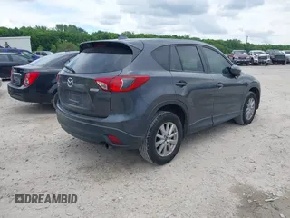 2014 Mazda CX-5 Sport z VIN JM3KE4BE6E0404753, wystawiony jako IAAI lot #42260554 z przebiegiem 144 688 mil mil oraz . Historia ofert i sprzedaży dostępna na DreamBid. Obrazek 4.