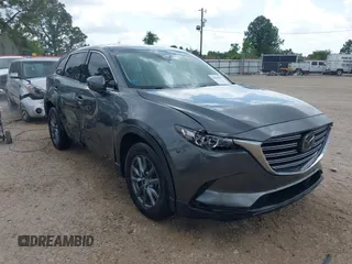 2020 Mazda CX-9 Touring with VIN JM3TCACYXL0400316, listed as a IAAI auction lot 42066503 with 108,898 mi miles and . Bid and sale history available at DreamBid. Image 1.