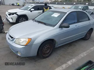 2005 Kia Spectra LX with VIN KNAFE121755142490, listed as a IAAI auction lot 42085928 with 170,406 mi miles. Bid and sale history available at carsss.com. Image 2.