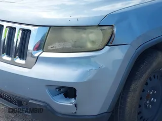 2013 Jeep Grand Cherokee Laredo with VIN 1C4RJEAG2DC517303, listed as a IAAI auction lot 42040405 with 222,952 mi miles. Bid and sale history available at carsss.com. Image 6.