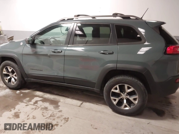 2015 Jeep Cherokee Trailhawk with VIN 1C4PJMBS6FW724931, listed as a IAAI auction lot 41602181 with 153,340 mi miles and . Bid and sale history available at carsss.com. Image 15.