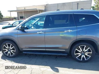 2021 Honda Pilot Touring 8-Passenger with VIN 5FNYF6H97MB034399, listed as a IAAI auction lot 42303419 with 50,034 mi miles and . Bid and sale history available at DreamBid. Image 15.