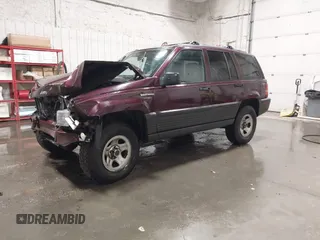1995 Jeep Grand Cherokee Laredo with VIN 1J4GZ58S2SC679918, listed as a IAAI auction lot 41840415 with 261,434 mi miles. Bid and sale history available at carsss.com. Image 2.