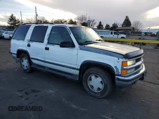 1997 GMC Yukon with VIN 1GKEK13R0VJ734501, listed as a Copart auction lot 48413785 with 165,440 mi miles and Clean Title. Bid and sale history available at carsss.com. Image 4.