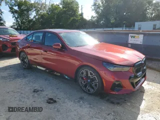 2024 BMW i5 eDrive40 with VIN WBY33FK01RCR76500, listed as a Copart auction lot 65026585 with 3,601 mi miles and Salvage title. Bid and sale history available at DreamBid. Image 4.