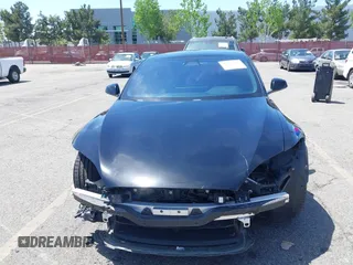 2022 Tesla Model S with VIN 5YJSA1E51NF464231, listed as a IAAI auction lot 42077838 with 53,290 mi miles and . Bid and sale history available at DreamBid. Image 13.