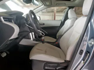 2023 Toyota Corolla Cross LE with VIN 7MUBAAAG4PV042580, listed as a Copart auction lot 63797305 with 59,576 mi miles and Salvage title. Bid and sale history available at DreamBid. Image 7.