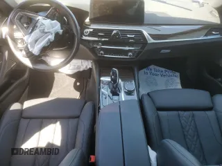 2023 BMW 5 Series 530e with VIN WBA13AG00PCL24045, listed as a Copart auction lot 84961634 with Not provided miles and Salvage title. Bid and sale history available at DreamBid. Image 8.