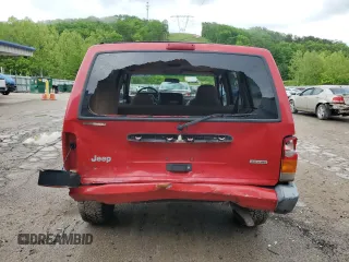 2001 Jeep Cherokee Sport with VIN 1J4FT48S41L570480, listed as a Copart auction lot 56123925 with 216,338 mi miles and Salvage title. Bid and sale history available at DreamBid. Image 6.