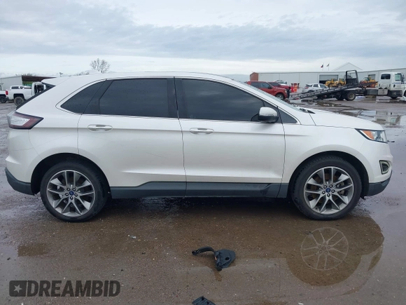 2015 Ford Edge Titanium z VIN 2FMTK3K82FBC42299, wystawiony jako IAAI lot #41912657 z przebiegiem 198 144 mil mil oraz . Historia ofert i sprzedaży dostępna na DreamBid. Obrazek 13.
