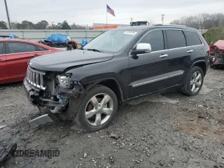 2013 Jeep Grand Cherokee Overland with VIN 1C4RJECG1DC546398, listed as a Copart auction lot 45834595 with 214,975 mi miles and Salvage Title. Bid and sale history available at carsss.com. Image 1.