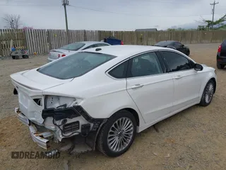 2013 Ford Fusion Titanium Hybrid with VIN 3FA6P0RU5DR357469, listed as a IAAI auction lot 41969315 with 215,732 mi miles. Bid and sale history available at carsss.com. Image 4.