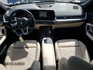 2023 BMW X1 xDrive28i with VIN WBX73EF05P5Y21721, listed as a Copart auction lot 50749295 with 10,633 mi miles and Salvage title. Bid and sale history available at DreamBid. Image 8.