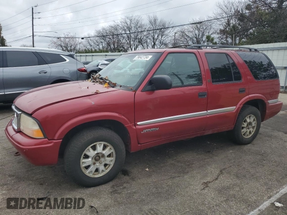 1999 GMC Jimmy SLE z VIN 1GKDT13W3X2546163, wystawiony jako Copart lot #79842734 z przebiegiem 144 800 mil mil oraz Szkoda całkowita • Salvage title. Historia ofert i sprzedaży dostępna na DreamBid. Obrazek 1.