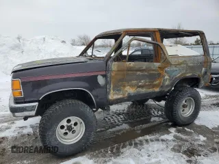 1987 Ford Bronco z VIN 1FMCU14T3HUC77415, wystawiony jako Copart lot #47737825 z przebiegiem Nie podano mil oraz Nie do naprawy • Non repairable. Historia ofert i sprzedaży dostępna na DreamBid. Obrazek 1.