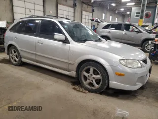 2002 Mazda Protege z VIN JM1BJ245X21565456, wystawiony jako Copart lot #43756385 z przebiegiem 195 892 mil mil oraz Szkoda całkowita • Salvage title. Historia ofert i sprzedaży dostępna na DreamBid. Obrazek 4.