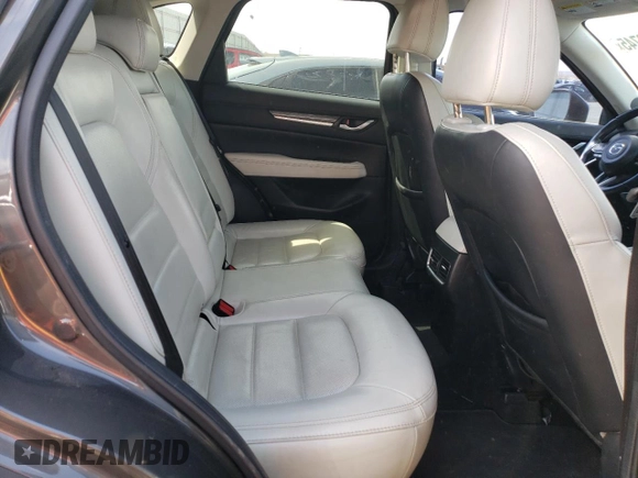 2018 Mazda CX-5 Grand Touring z VIN JM3KFBDM4J0300519, wystawiony jako Copart lot #51548745 z przebiegiem 102 853 mil mil oraz Szkoda całkowita • Salvage title. Historia ofert i sprzedaży dostępna na DreamBid. Obrazek 11.