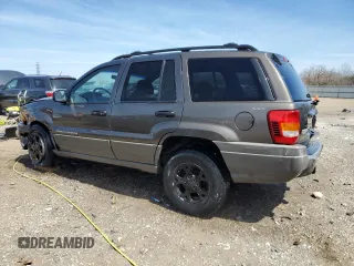 2000 Jeep Grand Cherokee Laredo z VIN 1J4GW48N9YC239166, wystawiony jako Copart lot #53321135 z przebiegiem 142 162 mil mil oraz Szkoda całkowita • Salvage title. Historia ofert i sprzedaży dostępna na DreamBid. Obrazek 2.
