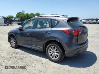 2014 Mazda CX-5 Sport with VIN JM3KE4BE6E0350595, listed as a Copart auction lot 61826475 with Not provided miles and Clean title. Bid and sale history available at DreamBid. Image 2.