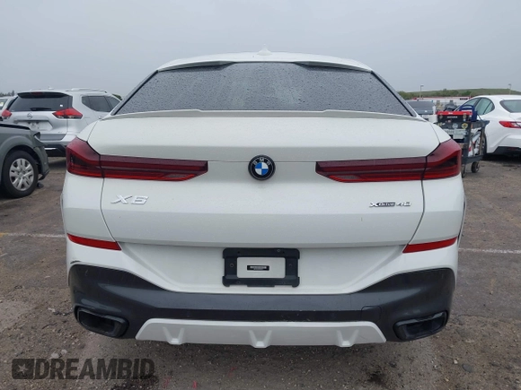 2021 BMW X6 xDrive40i z VIN 5UXCY6C00M9F88215, wystawiony jako IAAI lot #41646498 z przebiegiem 43 587 mil mil oraz . Historia ofert i sprzedaży dostępna na DreamBid. Obrazek 16.