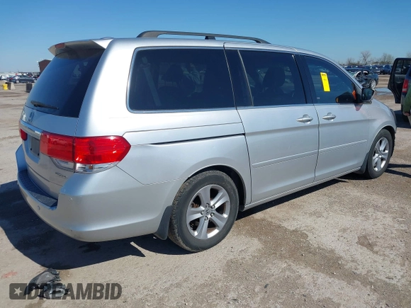 2010 Honda Odyssey Touring with VIN 5FNRL3H97AB015472, listed as a IAAI auction lot 41763680 with 144,309 mi miles. Bid and sale history available at carsss.com. Image 4.