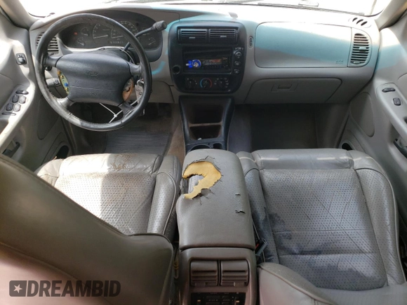 1997 Ford Explorer XL with VIN 1FMDU32E8VUC60285, listed as a Copart auction lot 66154644 with 219,066 mi miles and Salvage title. Bid and sale history available at DreamBid. Image 8.