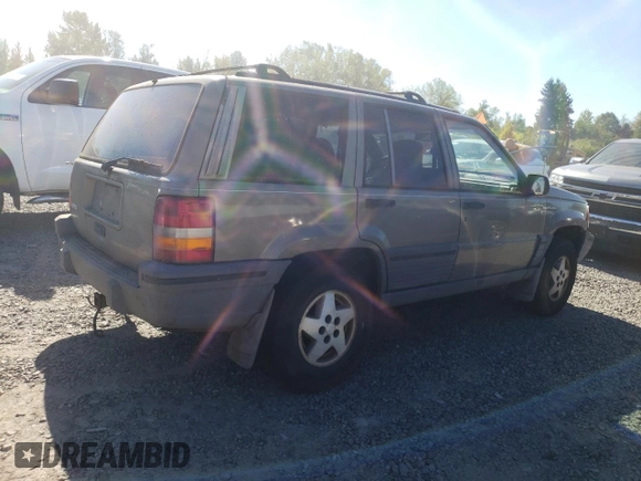 1995 Jeep Grand Cherokee Laredo with VIN 1J4FX58S1SC754691, listed as a Copart auction lot 72858214 with 251,234 mi miles and Salvage Title. Bid and sale history available at carsss.com. Image 3.