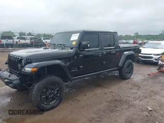 2023 Jeep Gladiator Overland with VIN 1C6JJTFM9PL593659, listed as a IAAI auction lot 42470253 with 34,374 mi miles and . Bid and sale history available at DreamBid. Image 2.