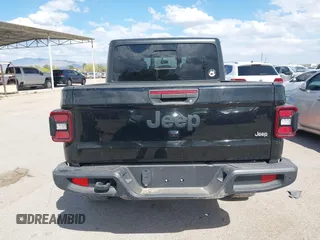 2021 Jeep Gladiator Willys with VIN 1C6HJTAG7ML523718, listed as a IAAI auction lot 42206058 with 48,071 mi miles and . Bid and sale history available at DreamBid. Image 16.
