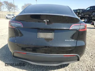 2023 Tesla Model Y Long Range with VIN 7SAYGAEE0PF642810, listed as a Copart auction lot 52181655 with 74,922 mi miles and Salvage Title. Bid and sale history available at DreamBid. Image 6.