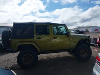 2008 Jeep Wrangler Unlimited Sahara with VIN 1J4GA59148L545255, listed as a IAAI auction lot 42177758 with 155,953 mi miles and . Bid and sale history available at DreamBid. Image 14.
