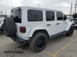 2023 Jeep Wrangler Sahara with VIN 1C4JJXP63PW536694, listed as a Copart auction lot 63409845 with 32,560 mi miles and Salvage title. Bid and sale history available at DreamBid. Image 3.
