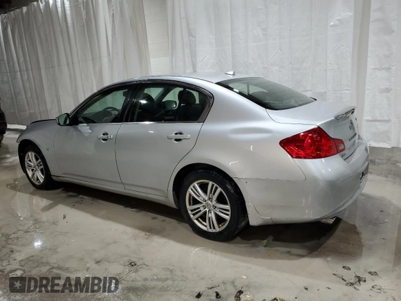 2015 Infiniti Q40 with VIN JN1CV6AR3FM651013, listed as a Copart auction lot 74568404 with 171,155 mi miles and Salvage Title. Bid and sale history available at carsss.com. Image 2.