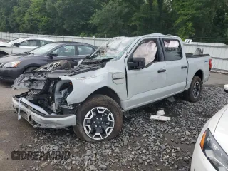 2023 Ford F-150 Lightning Pro with VIN 1FTVW1EL9PWG58758, listed as a Copart auction lot 64410814 with 0 mi miles and Salvage Title. Bid and sale history available at carsss.com. Image 1.