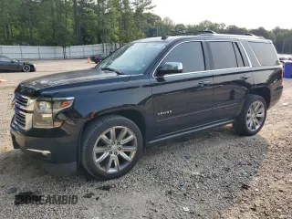 2015 Chevrolet Tahoe LTZ with VIN 1GNSKCKC5FR169096, listed as a Copart auction lot 57308215 with 99,515 mi miles and Salvage title. Bid and sale history available at DreamBid. Image 1.