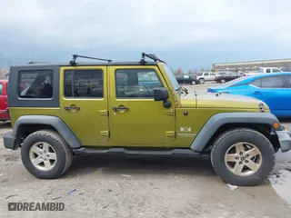 2008 Jeep Wrangler Unlimited X with VIN 1J4GA39158L529523, listed as a IAAI auction lot 41979992 with 304,641 mi miles. Bid and sale history available at carsss.com. Image 13.