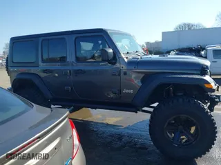 2019 Jeep Wrangler Unlimited Sport S with VIN 1C4HJXDG2KW612913, listed as a IAAI auction lot 41519311 with 104,583 mi miles. Bid and sale history available at carsss.com. Image 14.