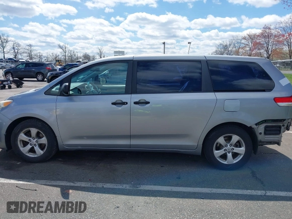 2013 Toyota Sienna L with VIN 5TDZK3DC9DS298333, listed as a IAAI auction lot 41941011 with 141,021 mi miles. Bid and sale history available at carsss.com. Image 14.
