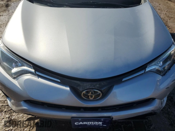 2018 Toyota RAV4 LE with VIN 2T3BFREV2JW730084, listed as a Copart auction lot 50386335 with 56,650 mi miles and Salvage Title. Bid and sale history available at carsss.com. Image 13.