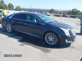 2013 Cadillac XTS Platinum z VIN 2G61U5S36D9217161, wystawiony jako IAAI lot #42509799 z przebiegiem 140 126 mil mil oraz . Historia ofert i sprzedaży dostępna na DreamBid. Obrazek 1.