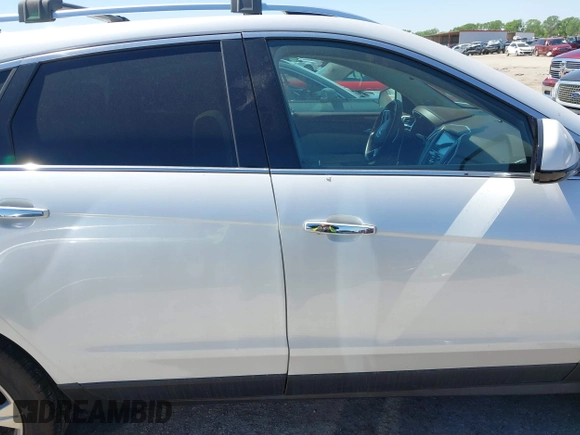 2014 Cadillac SRX Performance Collection with VIN 3GYFNFE35ES582897, listed as a IAAI auction lot 41978361 with 144,116 mi miles and . Bid and sale history available at DreamBid. Image 13.