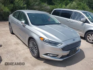 2017 Ford Fusion Hybrid Titanium with VIN 3FA6P0RU1HR317556, listed as a IAAI auction lot 42549706 with 77,744 mi miles and . Bid and sale history available at DreamBid. Image 1.