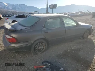 2000 Mazda 626 LX with VIN 1YVGF22D5Y5120152, listed as a Copart auction lot 44571595 with 177,624 mi miles and Salvage Title. Bid and sale history available at carsss.com. Image 3.
