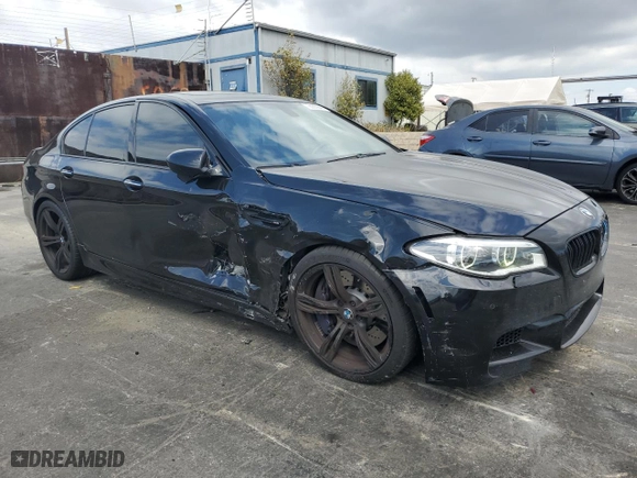 2015 BMW M5 with VIN WBSFV9C56FD594465, listed as a Copart auction lot 72085944 with 76,313 mi miles and Salvage Title. Bid and sale history available at carsss.com. Image 4.