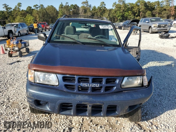 2002 Isuzu Rodeo S with VIN 4S2CK58W124307433, listed as a Copart auction lot 75447074 with 129,163 mi miles and Salvage title. Bid and sale history available at DreamBid. Image 5.