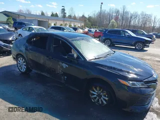 2018 Toyota Camry LE z VIN 4T1B11HK4JU067885, wystawiony jako IAAI lot #41885909 z przebiegiem 122 020 mil mil oraz . Historia ofert i sprzedaży dostępna na DreamBid. Obrazek 1.