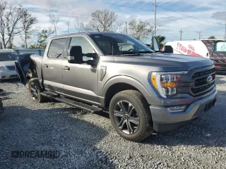 2023 Ford F-150 XL with VIN 1FTEW1EP4PFB38678, listed as a Copart auction lot 43024045 with 8,718 mi miles and Salvage title. Bid and sale history available at DreamBid. Image 4.