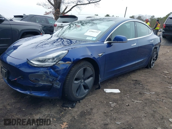 2020 Tesla Model 3 Standard Range Plus with VIN 5YJ3E1EA1LF658521, listed as a IAAI auction lot 41804722 with 83,248 mi miles and . Bid and sale history available at DreamBid. Image 2.